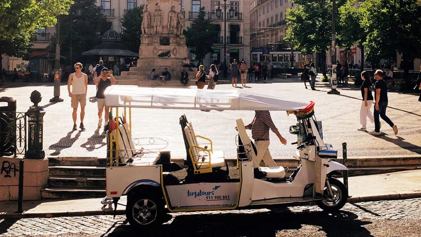 A David Tours tuk-tuk parked at Praça Luís de Camões in Lisbon