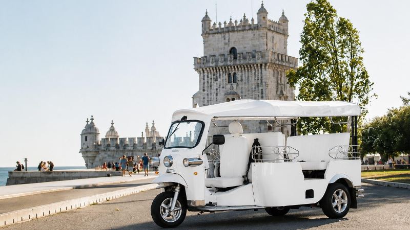 A David Tours tuk-tuk parked in front of Belém Tower